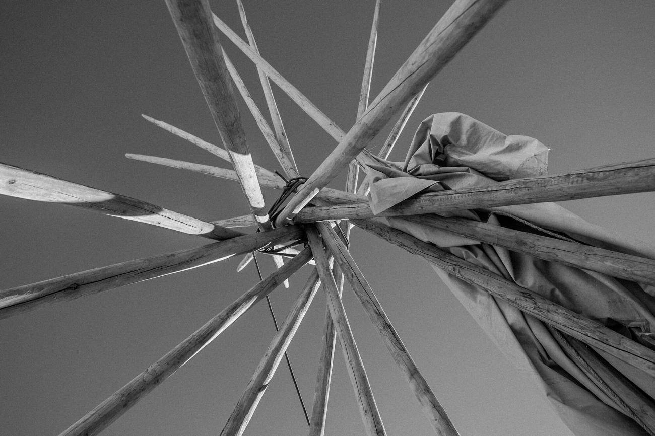 abstract black and white photo of outdoor wooden art exhibit